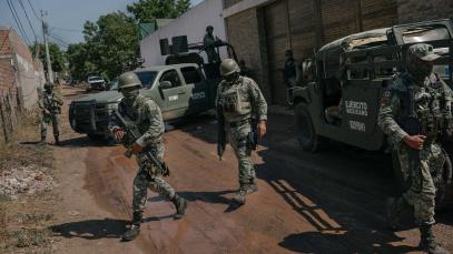 CULIACAN, SINALOA, MEXICO, October 22, 2024: Members of the military arrive at a scene where a key mid-level operator for Ismael "El Mayo" Zambada was captured following a fierce battle between the military and civilians, leaving 19 civilians dead. 