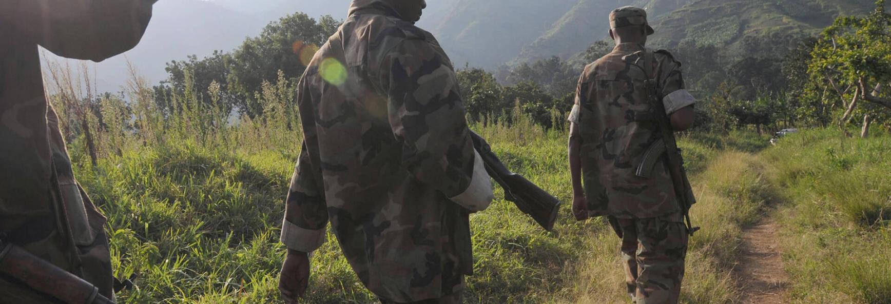 Image of Rwandan soldiers of the RDF (Rwandan Defence Force) patrol a path on 22 January 2009 in Tongo, 75kms north of the provincial capital Goma. 
