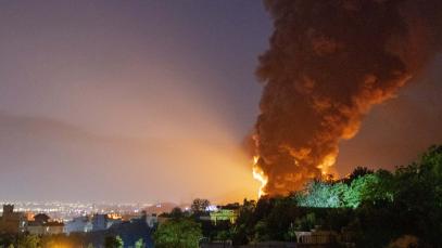 Fire and smoke rise into the sky after an Israeli attack on the Shahran oil depot on June 15, 2025 in Tehran, Iran.
